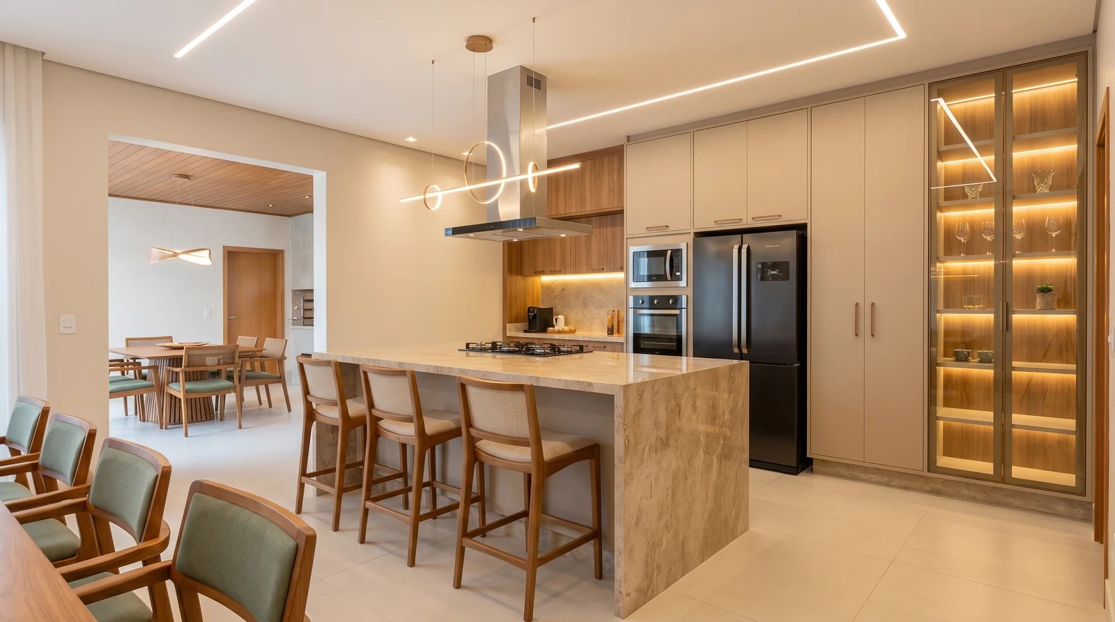 Cozinha contemporânea com ilha e marcenaria iluminada